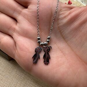 Boy and Girl Silver Pendant Necklace with Black Accents steel 316L